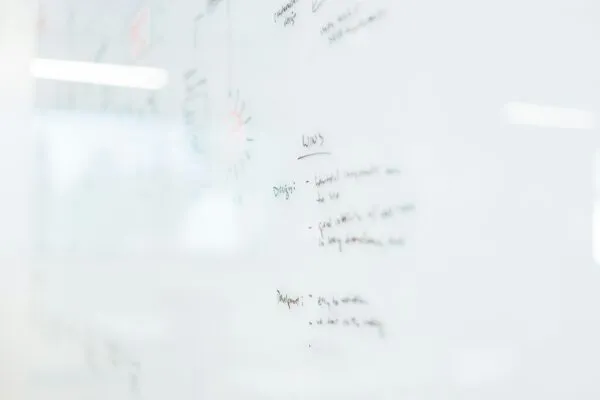 Whiteboard with planning sketches and post-it notes
